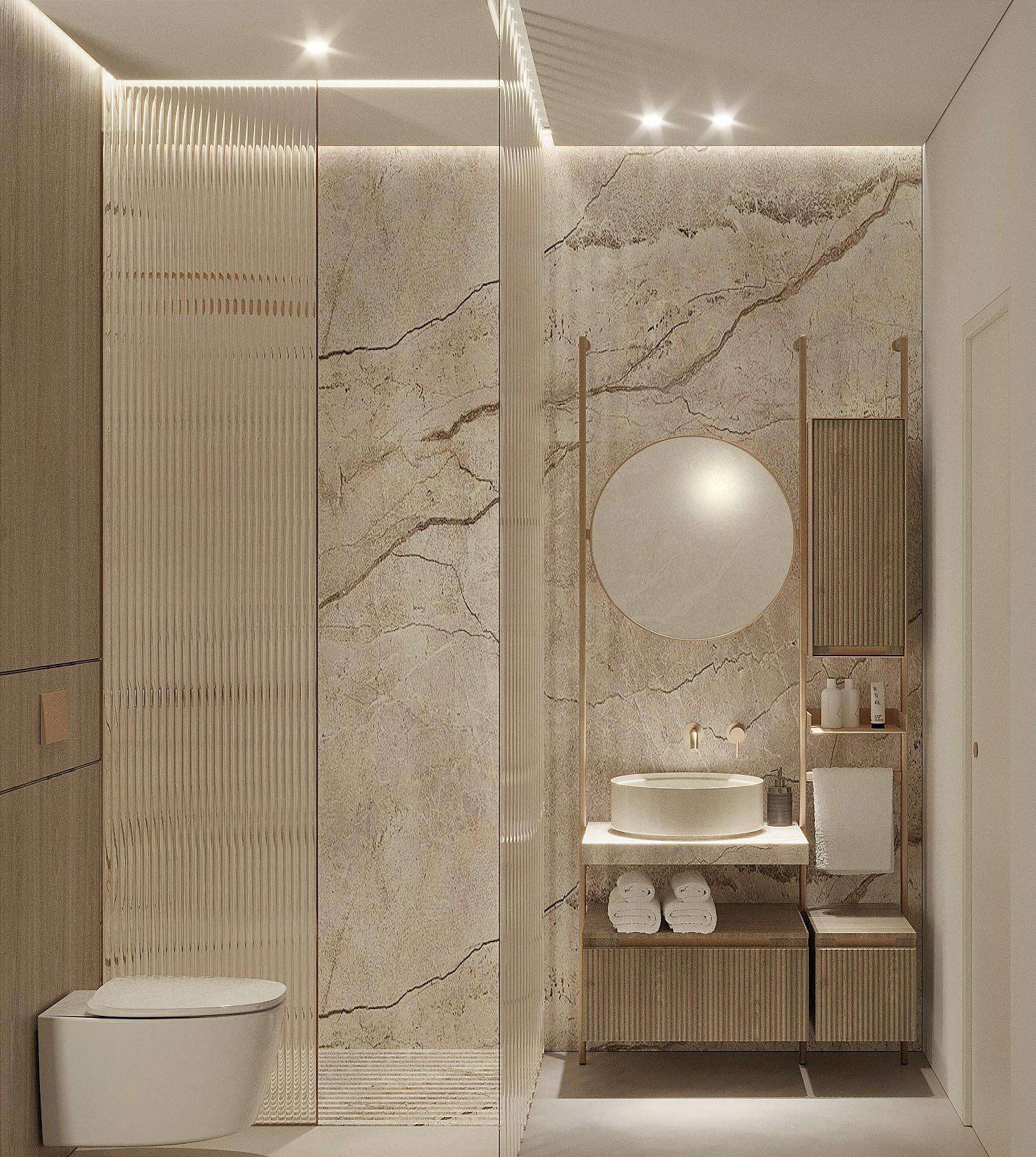 Bathroom with marble walls, round mirror and fluted glass shower screen